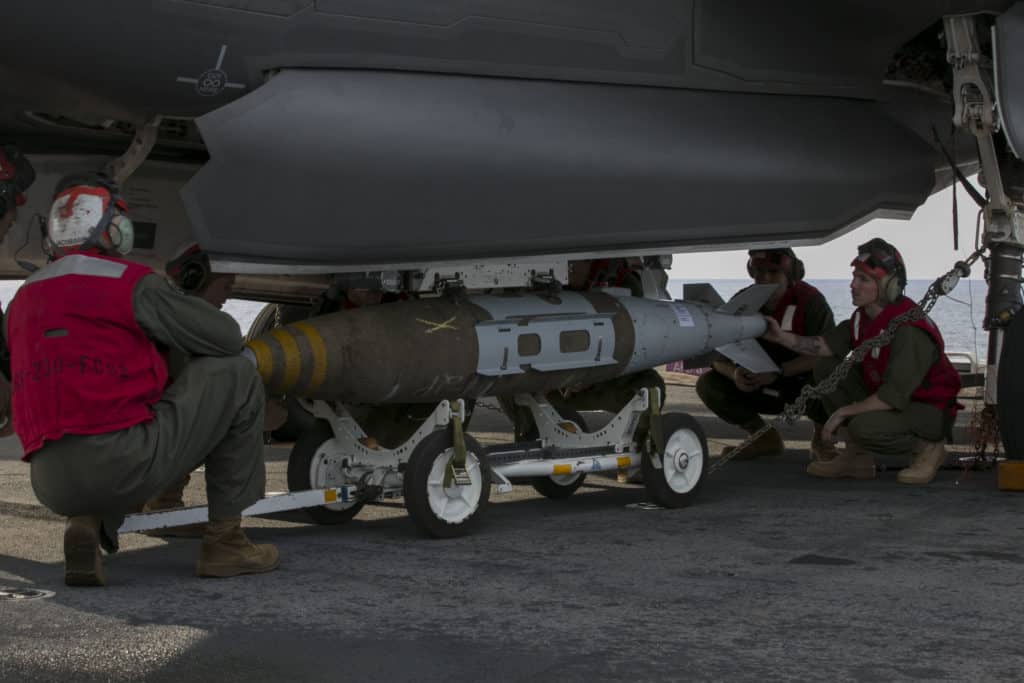 A GBU-32 Guided Bomb Unit being loaded on an F-35